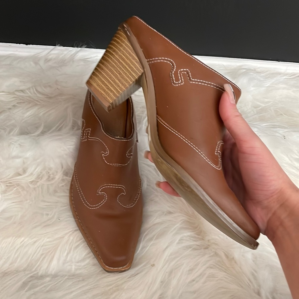 Brown boots with white stitching